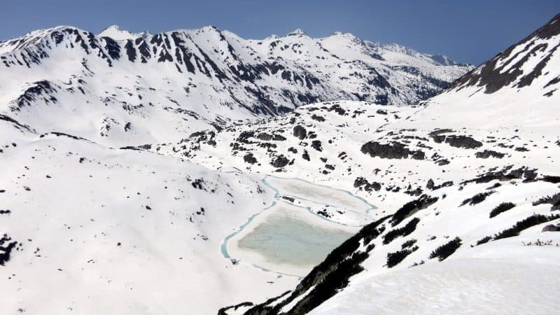 Early May in Pirin Mountains in 2015 - it was a snowy winter and there is still quite a lot of snow up the mountains, actually perfect time for ski touring. But the weather is quite hot already and in two weeks the scenery will change completely